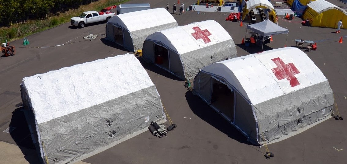 Aerial view of casualty management shelters with red crosses